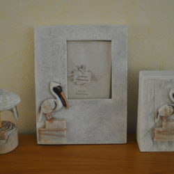 3 decoratieve Pelikaan-objecten (beeldje, fotolijstje, bakje met deksel)