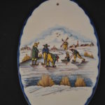Wandplaquette met ijs-tafereel (Arum)