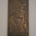 bronzen plaquette (pijprokende man)